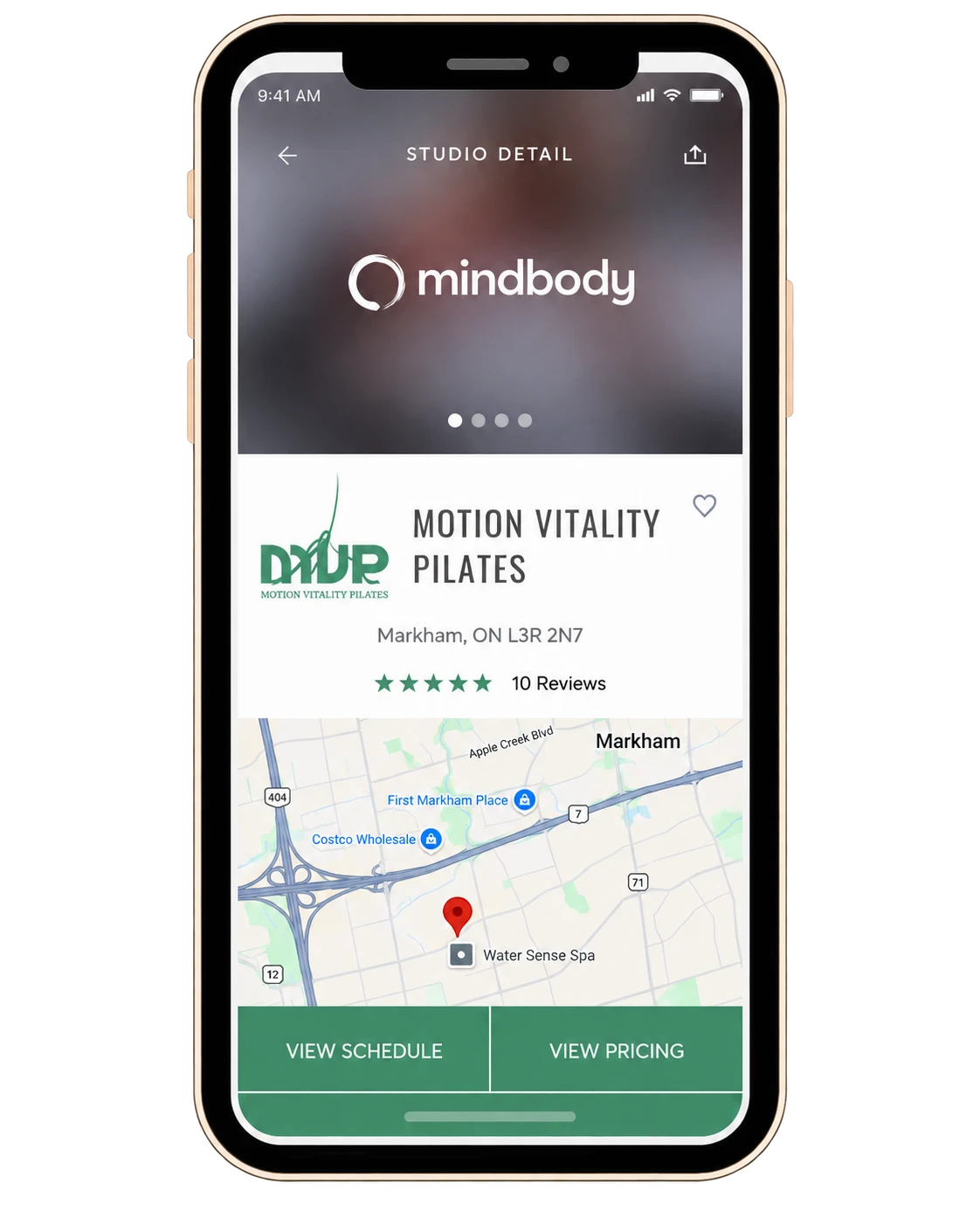 The Mindbody app showing the Motion Vitality Pilates studio page, ready to book.