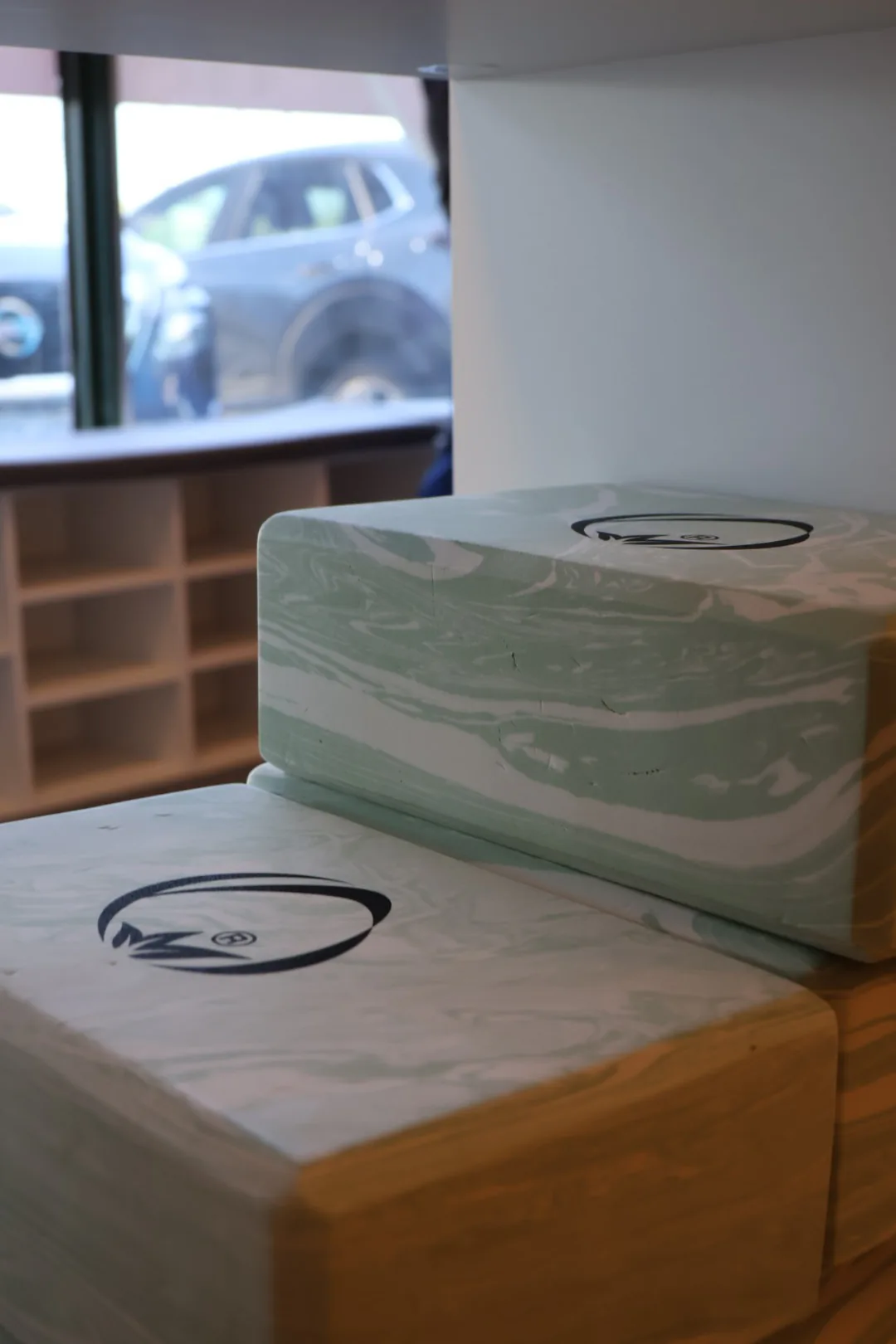 Supportive yoga blocks available beside the reformer room.