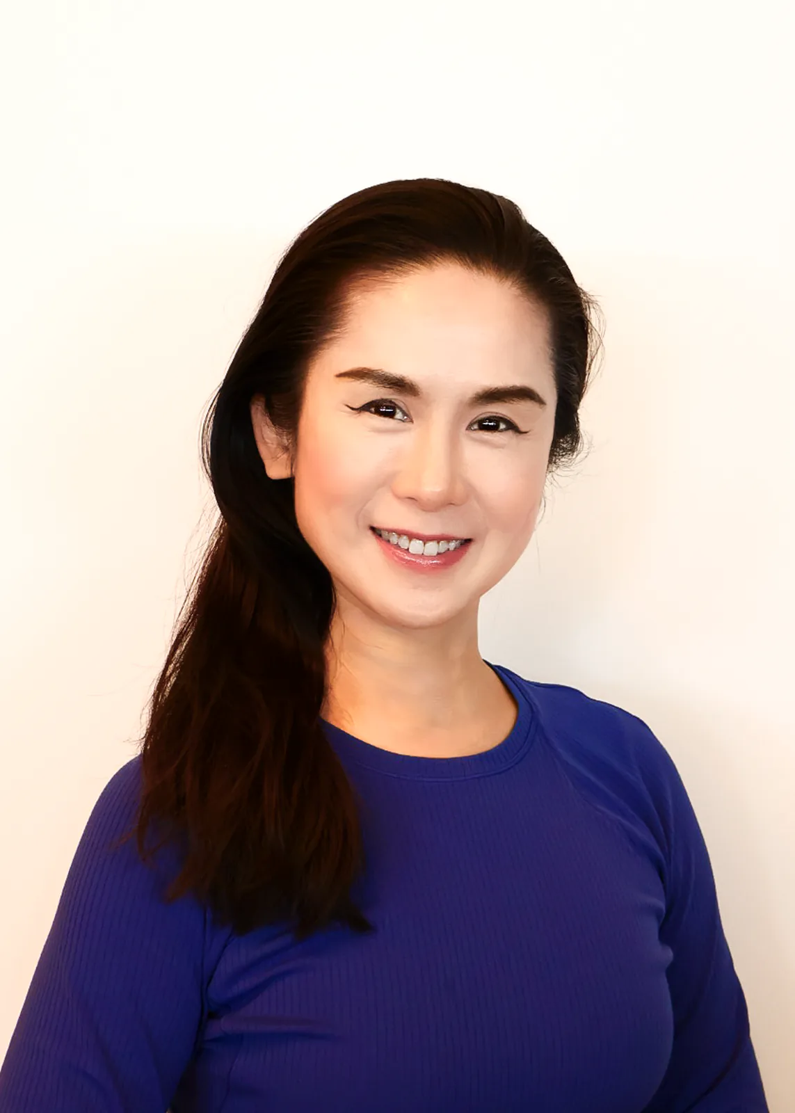 Portrait of Florence, Pilates instructor at Motion Vitality Pilates.